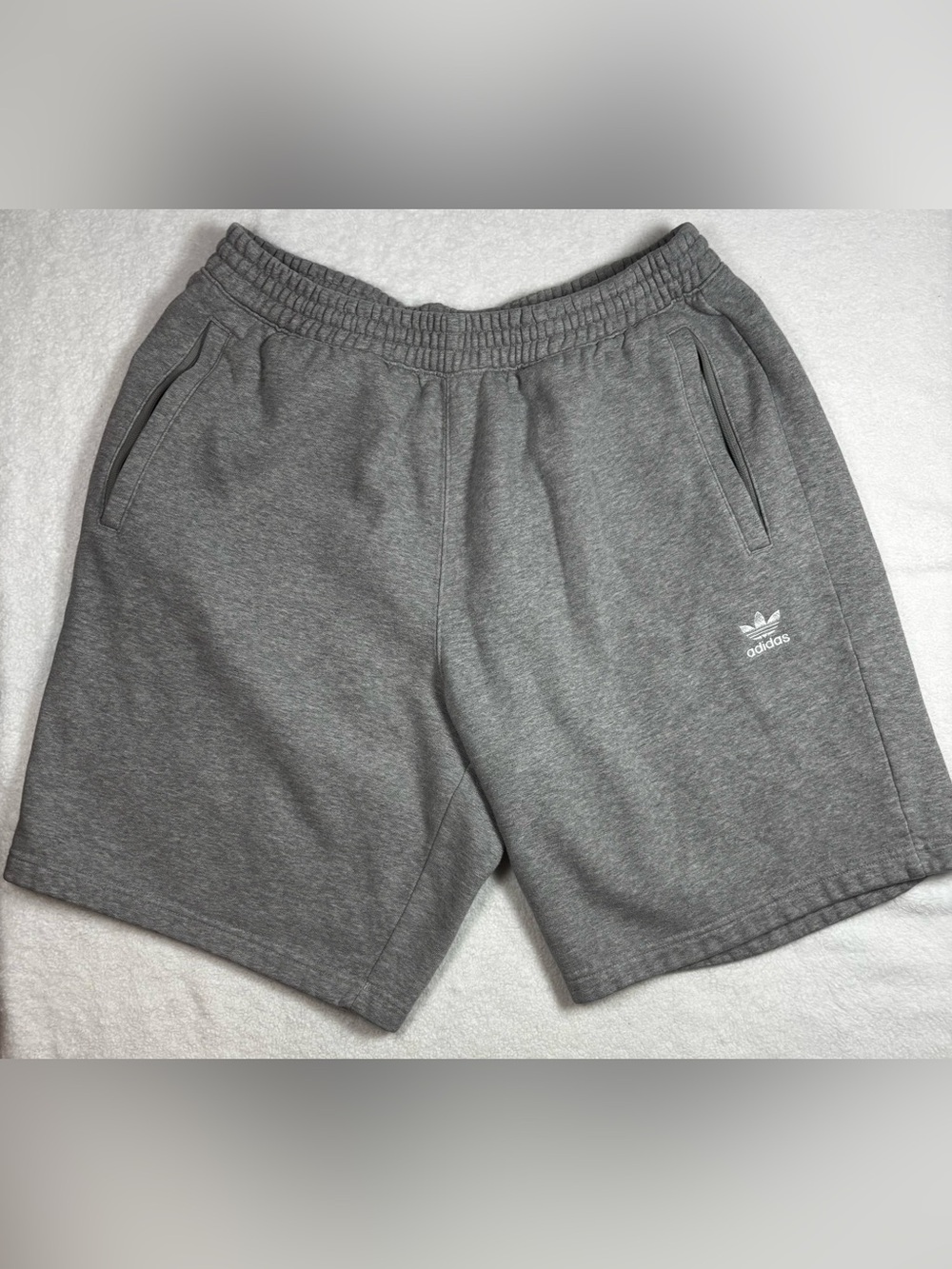 Adidas XL men’s gray shorts with zip pockets and soft fleece blend.